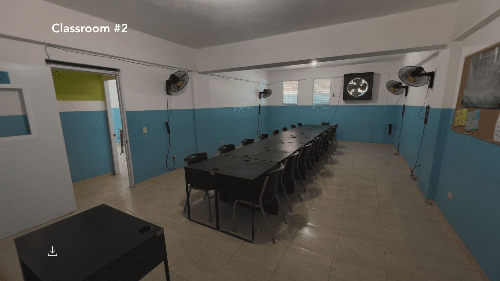 buyDRproperty Classroom in a Hostel Business for sale with long table and chairs. Sosua Real Estate
