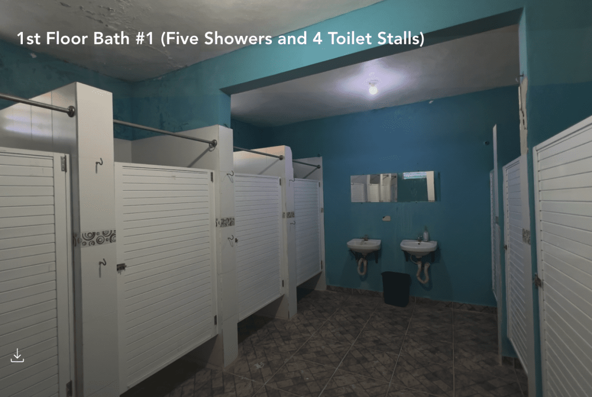 buyDRproperty Hostel bathroom with shower stalls and sinks. Sosua Real Estate