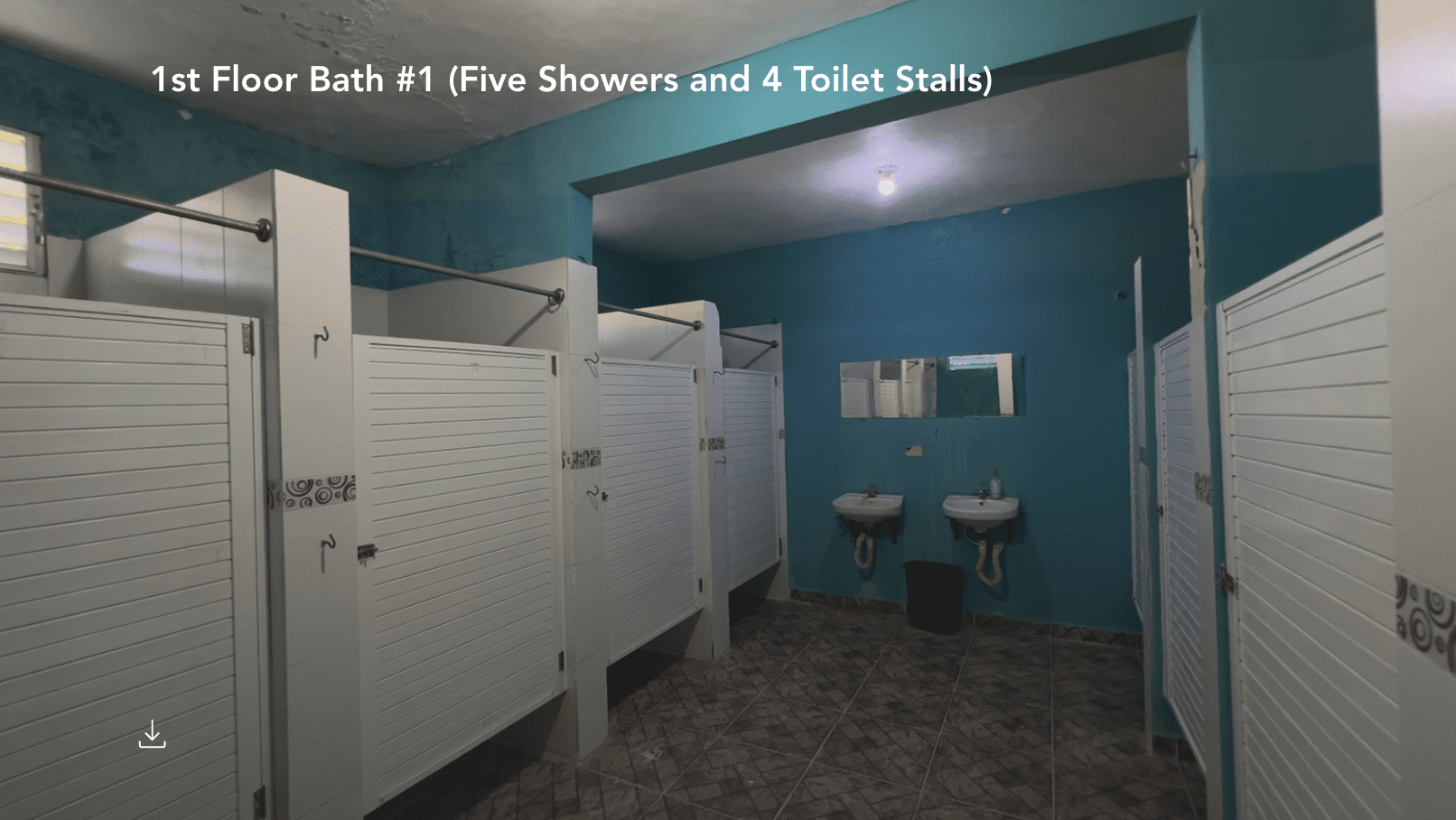 buyDRproperty Hostel bathroom with shower stalls and sinks. Sosua Real Estate