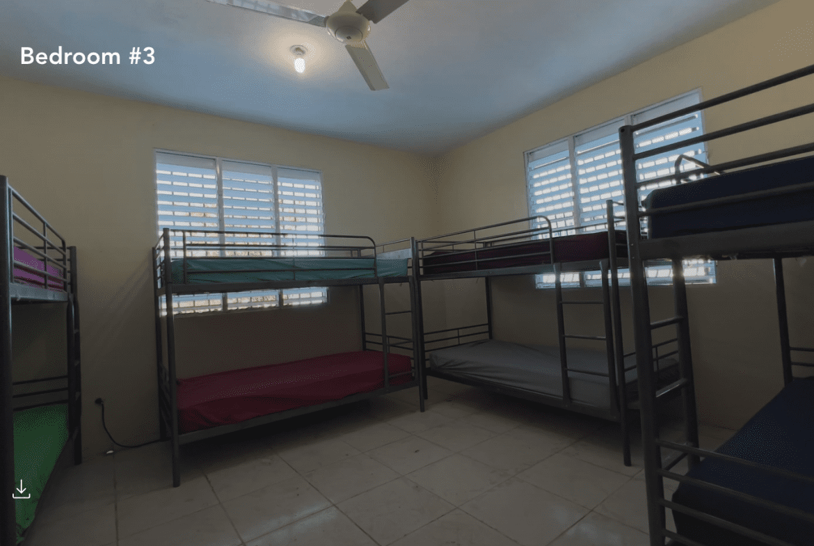 buyDRproperty Bedroom #3 with multiple bunk beds in a hostel business. Sosua Real Estate