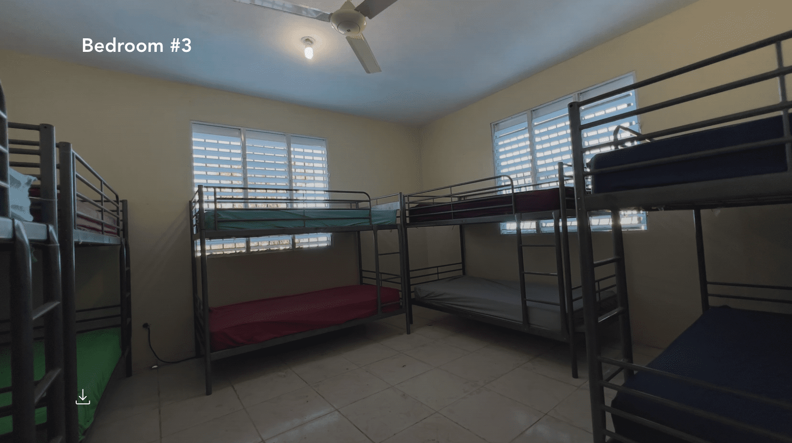 buyDRproperty Bedroom #3 with multiple bunk beds in a hostel business. Sosua Real Estate