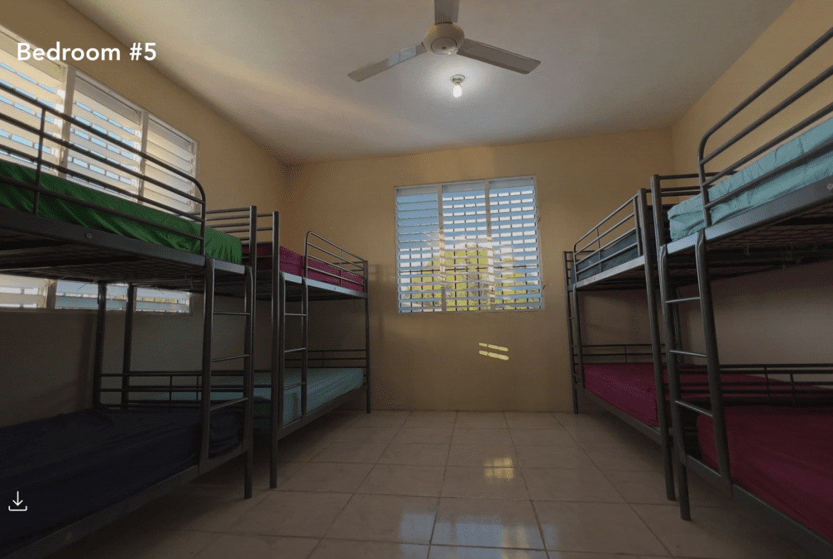 buyDRproperty Bedroom #5 in Hostel Business for Sale, featuring multiple bunk beds. Sosua Real Estate