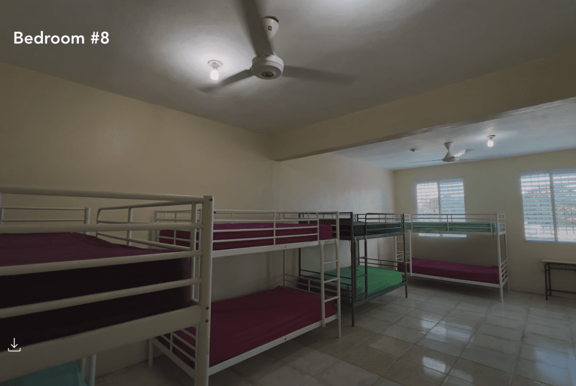 buyDRproperty Hostel room with multiple bunk beds, perfect for a hostel business. Sosua Real Estate