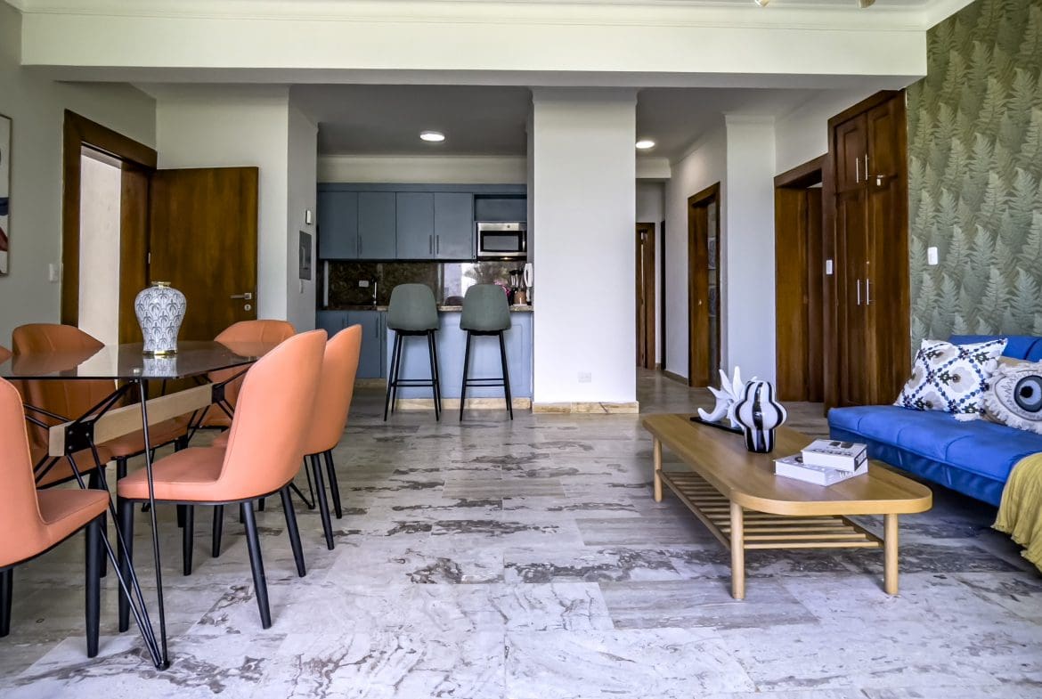 buyDRproperty Modern 3 bedroom oceanfront condo interior with dining area, kitchen, and living room. Sosua Real Estate