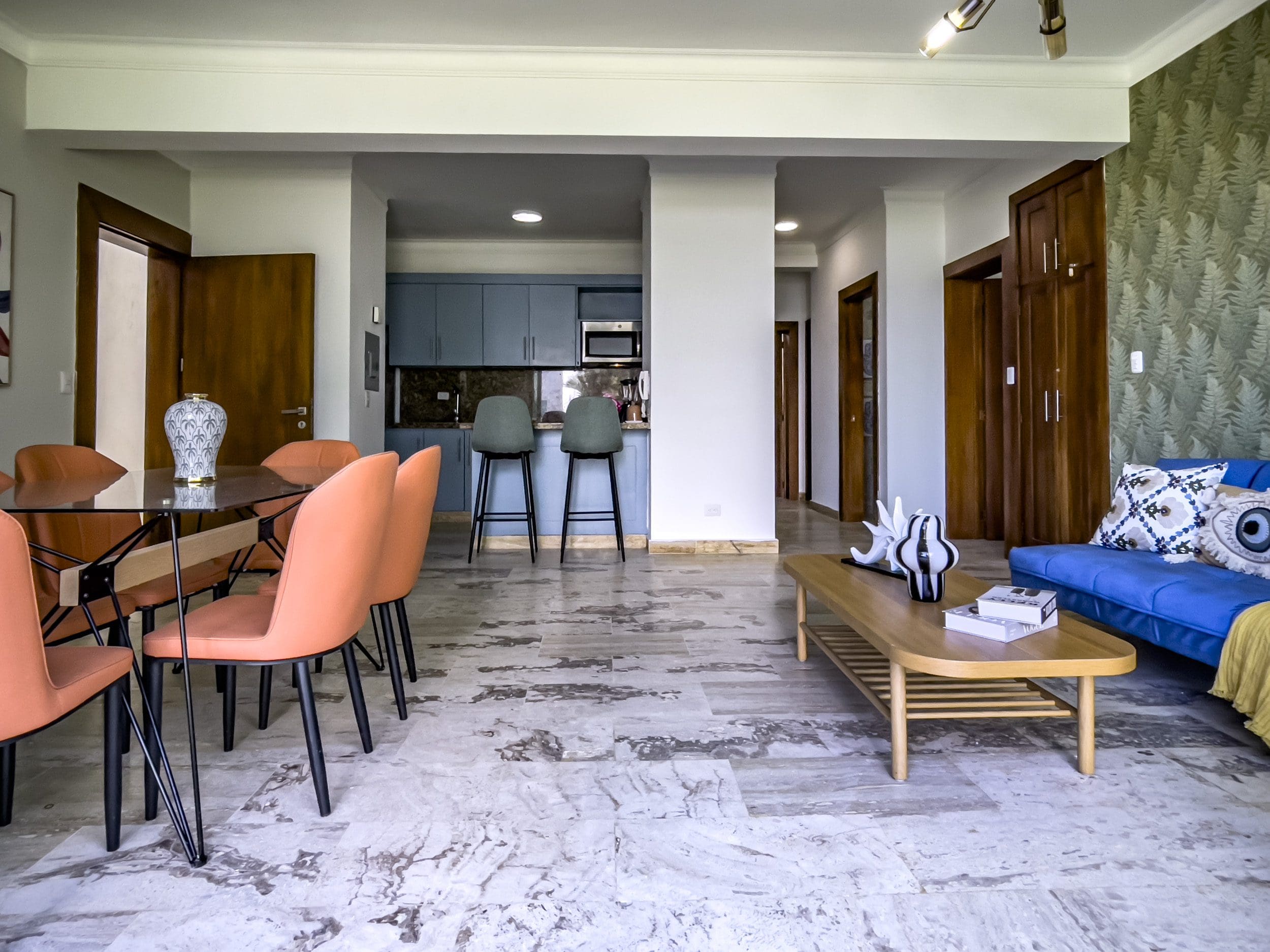 buyDRproperty Modern 3 bedroom oceanfront condo interior with dining area, kitchen, and living room. Sosua Real Estate
