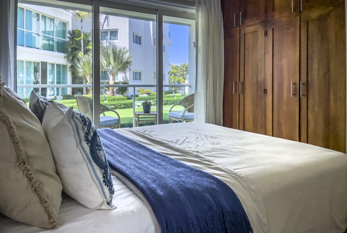 buyDRproperty Bedroom in a 3 Bedroom Oceanfront Condo with a view of the ocean. Sosua Real Estate