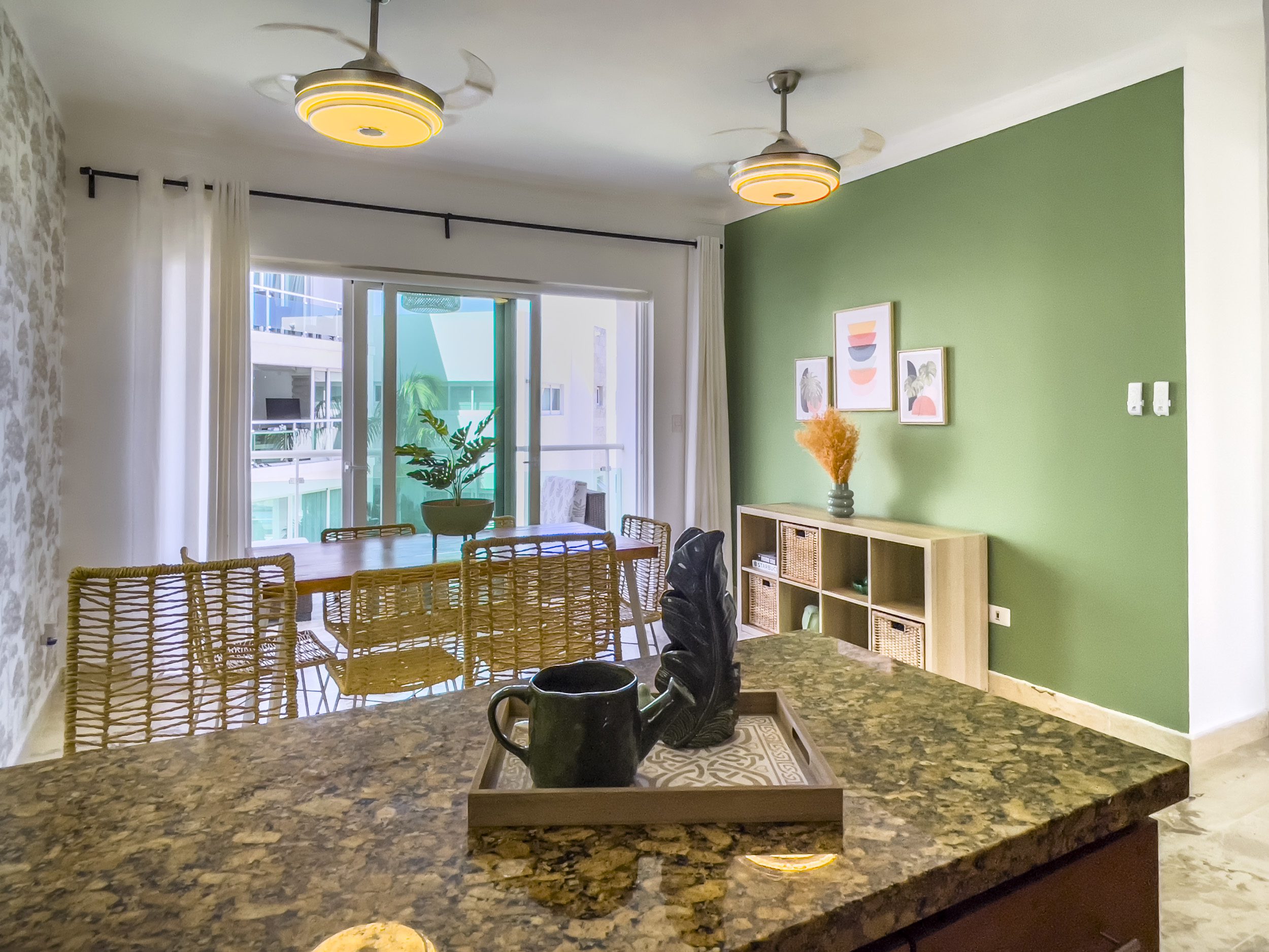 buyDRproperty Oceanfront condo for sale: modern kitchen with island and dining area. Sosua Real Estate