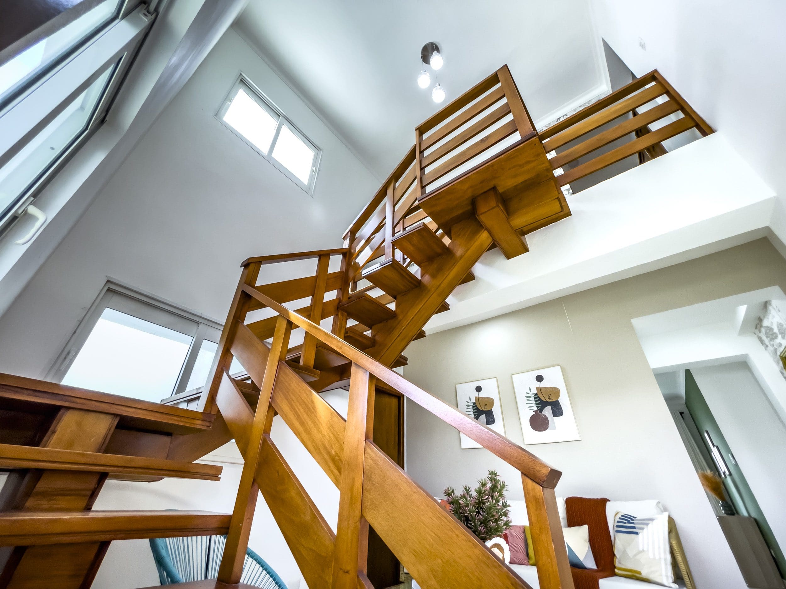 buyDRproperty Wooden staircase in a modern oceanfront condo for sale Sosua Real Estate