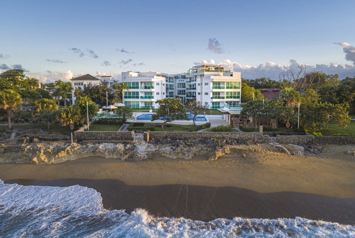 buyDRproperty Oceanfront condo for sale in Sosua with beach access and blue pool. Sosua Real Estate