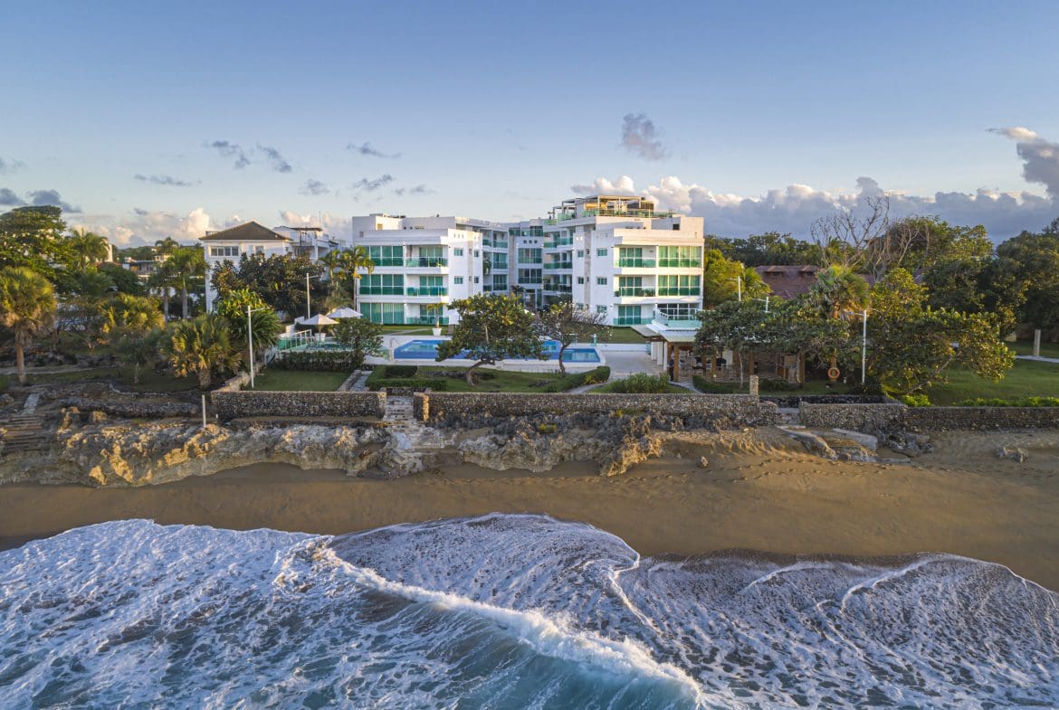 buyDRproperty Oceanfront condo with a beach and turquoise waves; perfect 3 bedroom oceanfront condo for sale. Sosua Real Estate