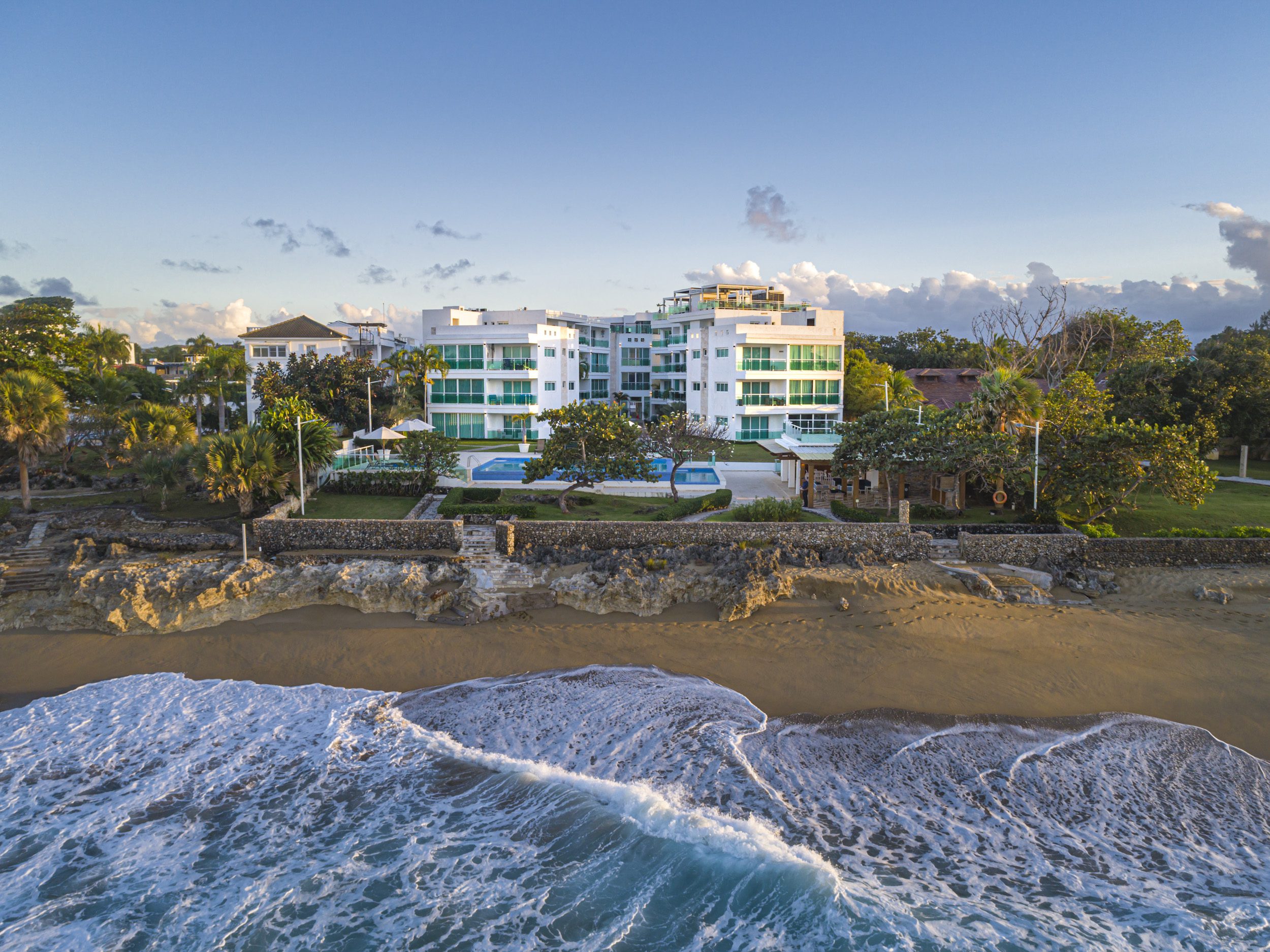 buyDRproperty Oceanfront condo with a beach and turquoise waves; perfect 3 bedroom oceanfront condo for sale. Sosua Real Estate