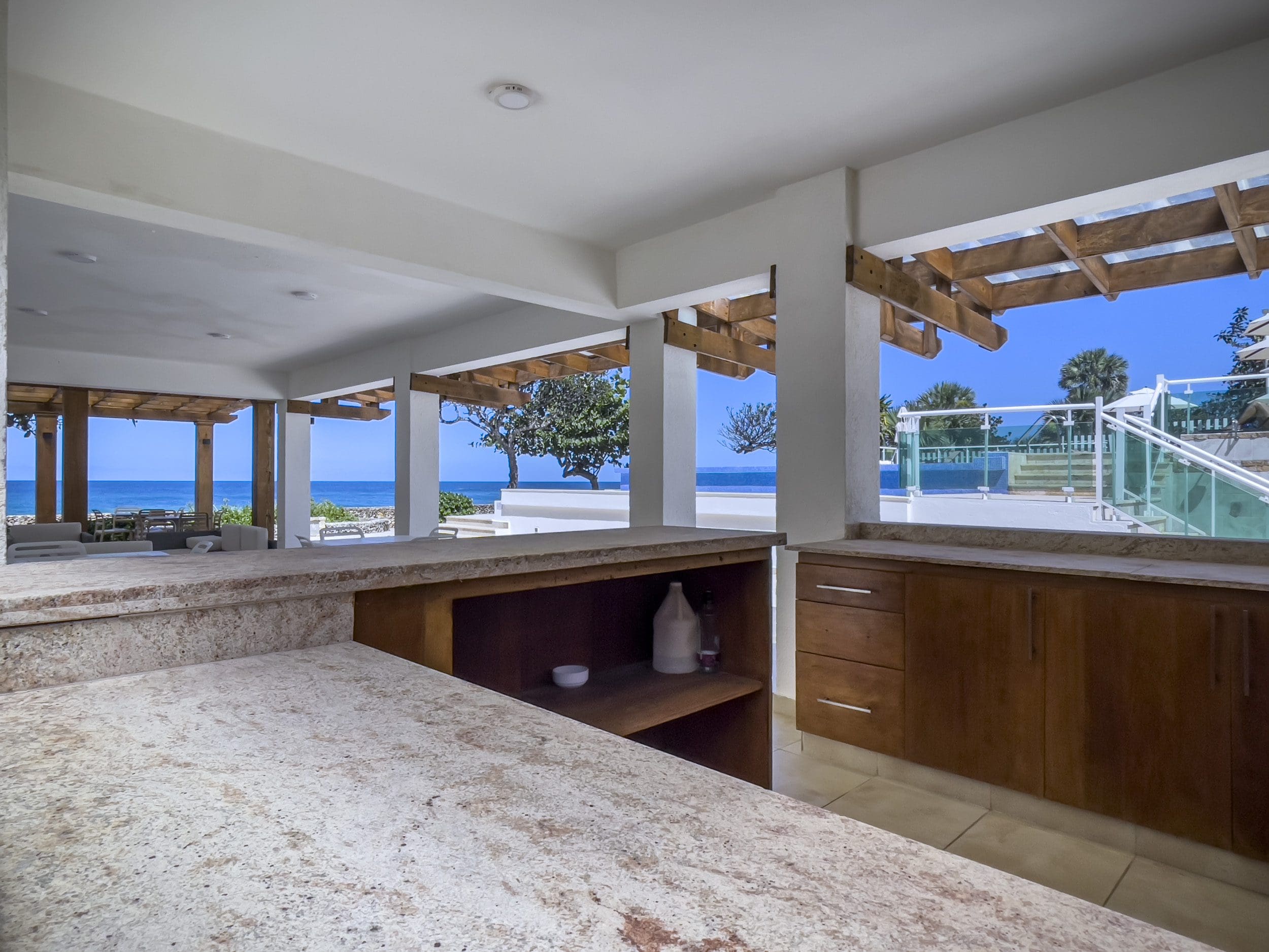 buyDRproperty Outdoor kitchen with ocean view at a 3 Bedroom Oceanfront Condo. Sosua Real Estate