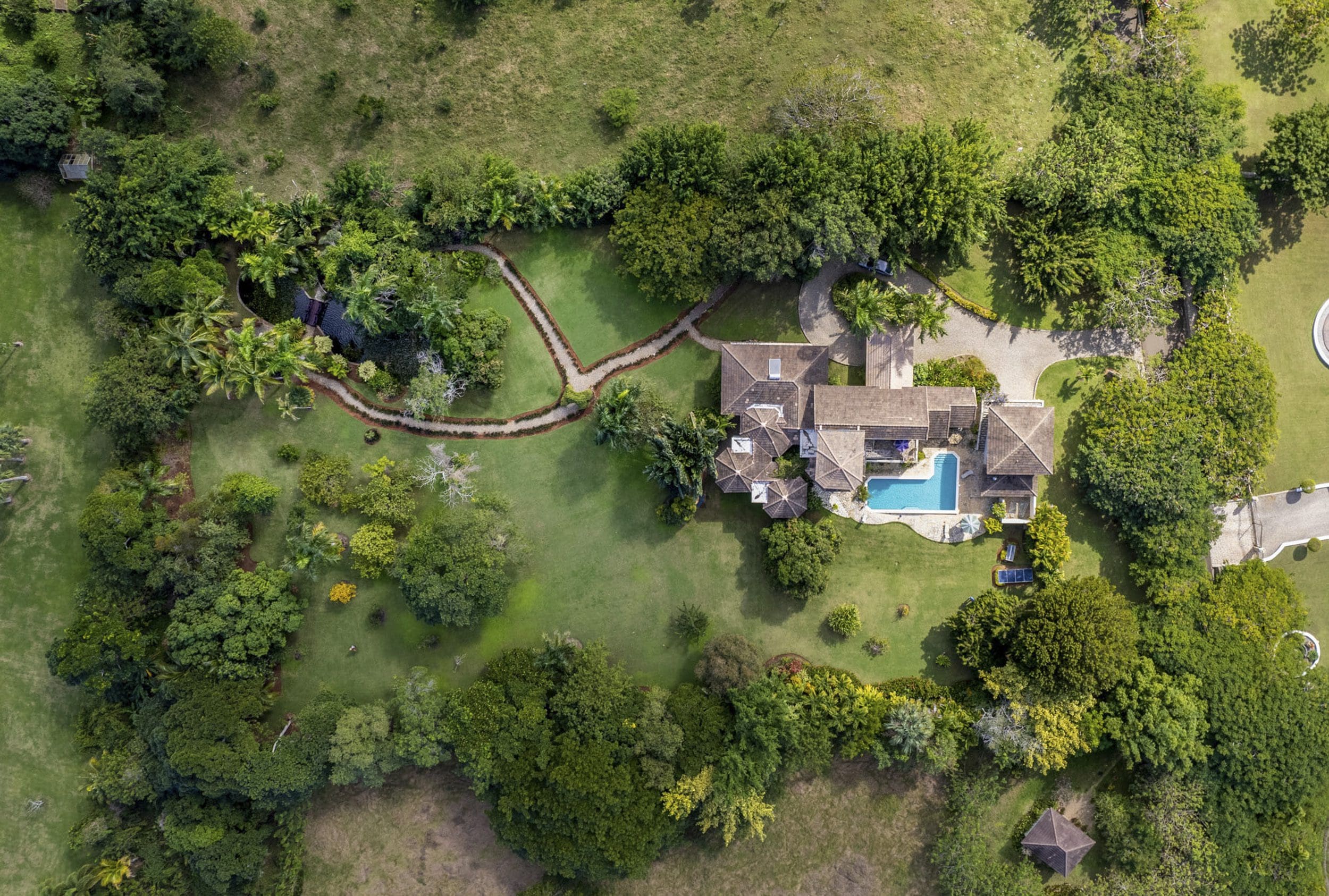 buyDRproperty Aerial view of a Beautiful 4 Bedroom Villa with a pool in a tropical setting. Haciendas el Choco Sosua Real Estate