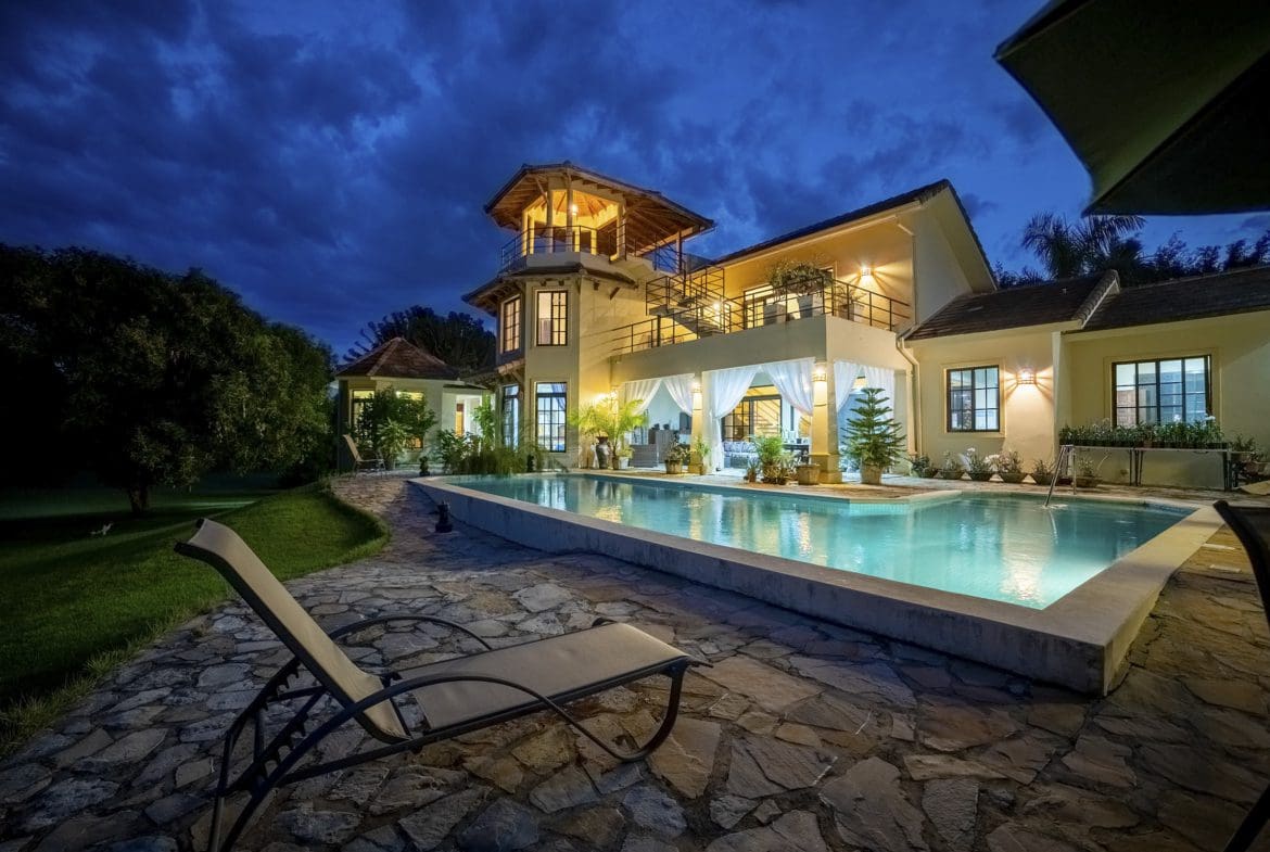 buyDRproperty Beautiful 4 Bedroom Villa for sale in Sosua with pool at night. Sosua Real Estate