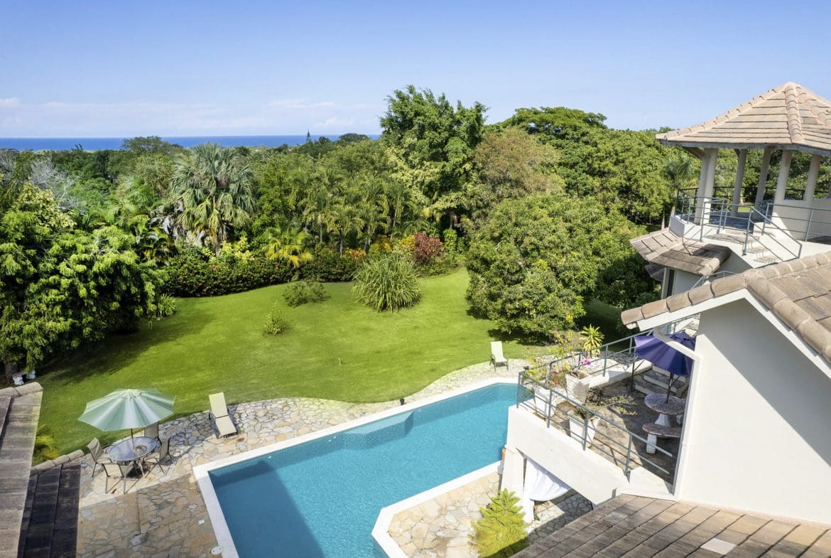 buyDRproperty Beautiful 4 bedroom villa for sale in Sosua with pool and lush landscaping. Sosua Real Estate