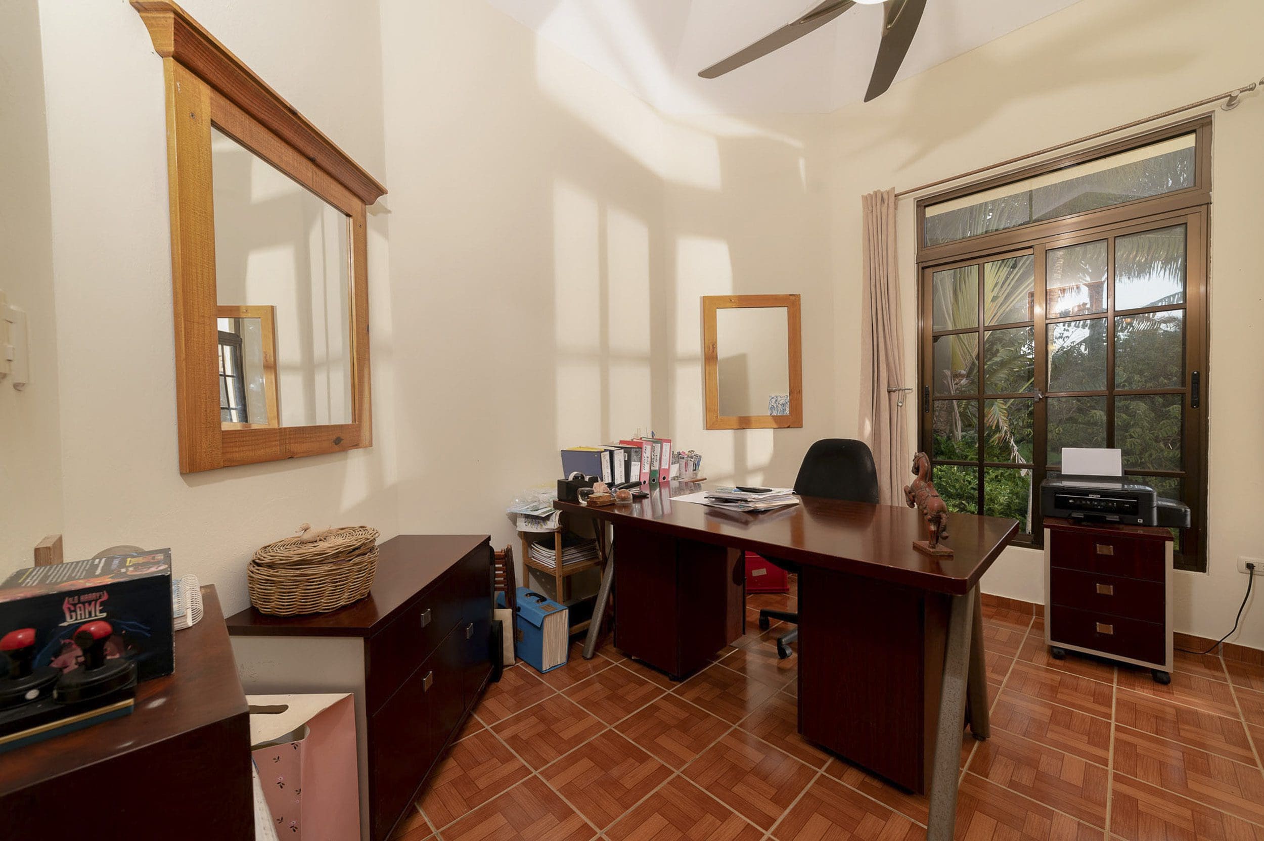 buyDRproperty Home office in a beautiful 4 bedroom villa, with a desk, printer, and a view of the garden. Sosua Real Estate
