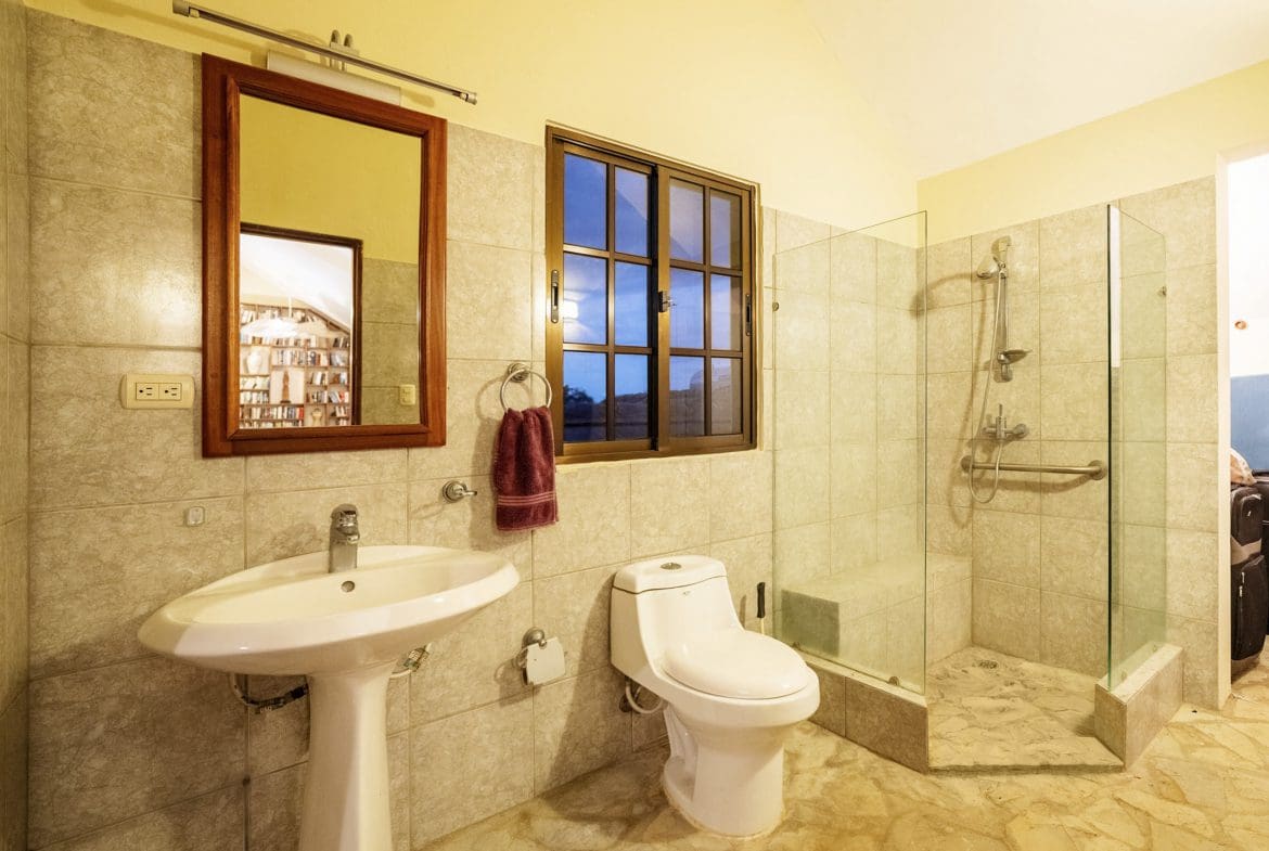 buyDRproperty Bathroom in a beautiful 4 bedroom villa for sale in Sosua, featuring a shower, sink, and toilet. Sosua Real Estate