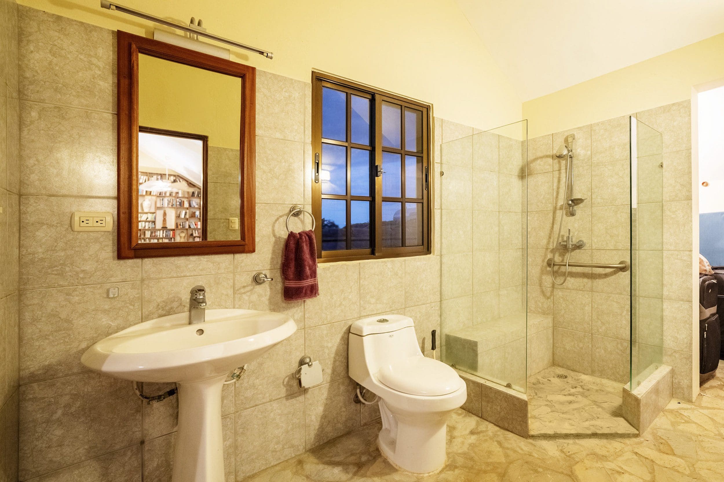 buyDRproperty Bathroom in a beautiful 4 bedroom villa for sale in Sosua, featuring a shower, sink, and toilet. Sosua Real Estate