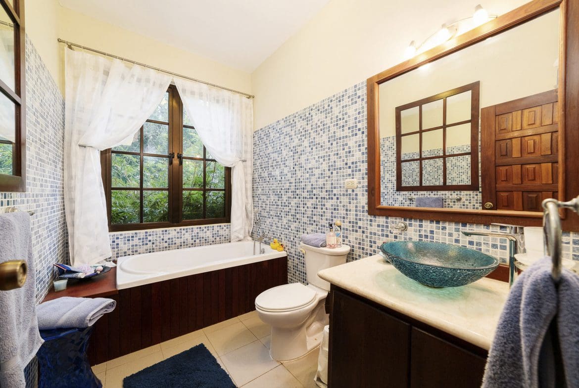 buyDRproperty Bathroom in a Beautiful 4 Bedroom Villa in Sosua with blue mosaic tile. Sosua Real Estate