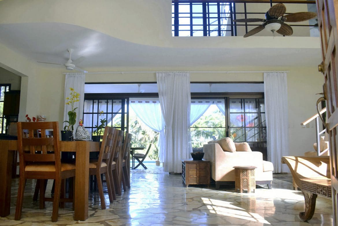 buyDRproperty Spacious living area in a Beautiful 4 Bedroom Villa For Sale in Sosua. Large windows with views. Sosua Real Estate