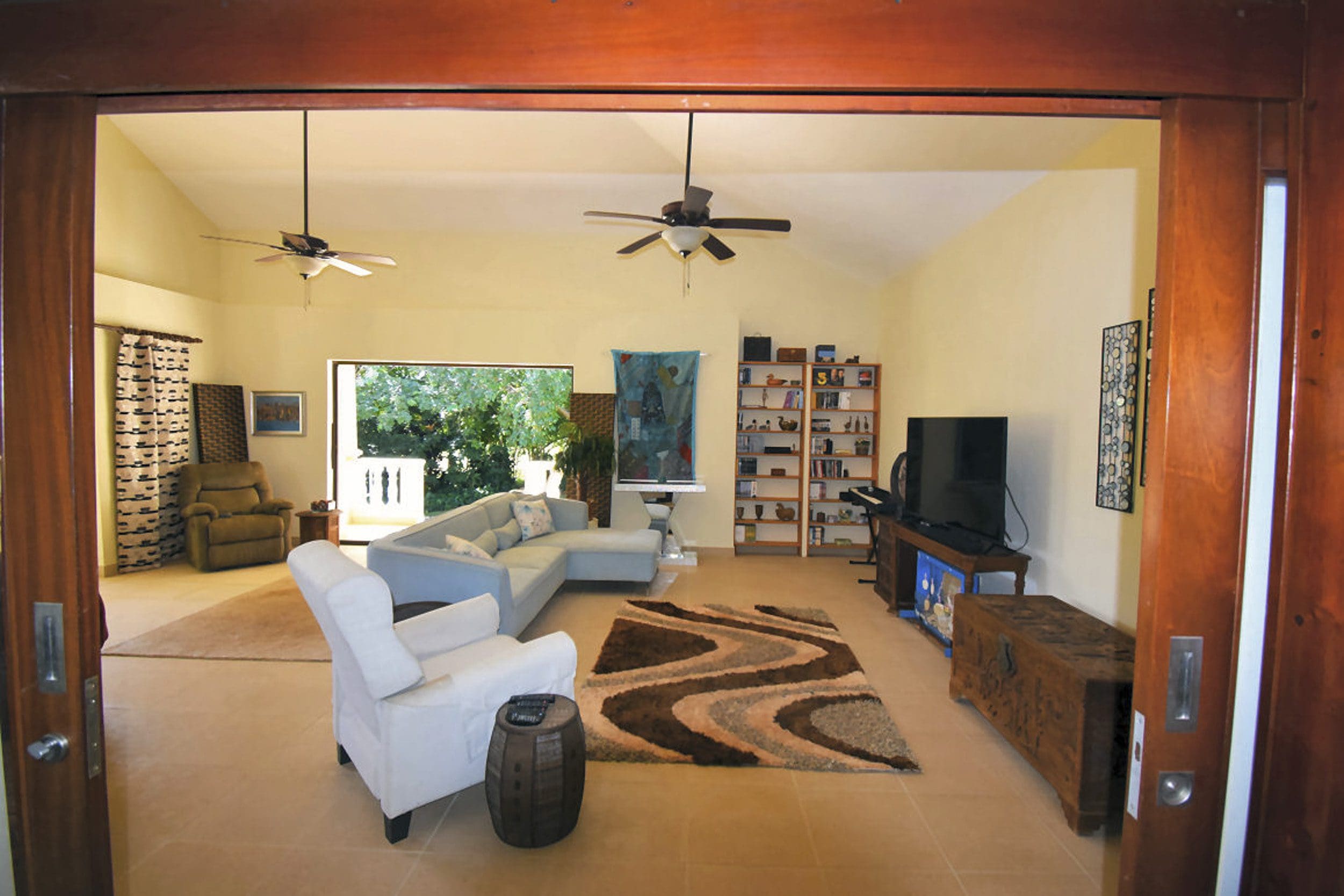 buyDRproperty Living room interior of a beautiful 4 bedroom villa, with sofa and rug. Sosua Real Estate