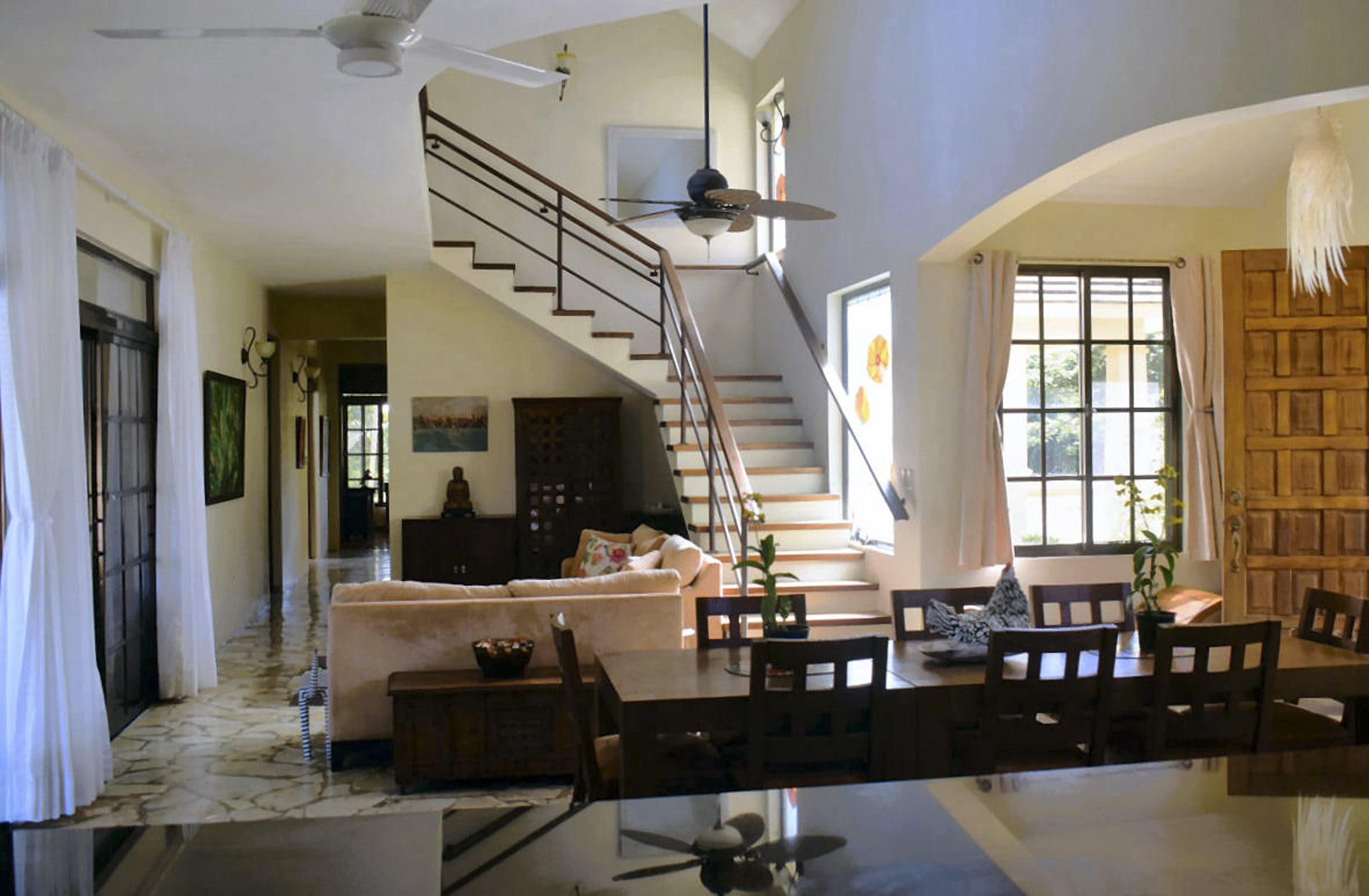 buyDRproperty Interior of a beautiful 4 bedroom villa for sale in Sosua, featuring a staircase and dining area. Sosua Real Estate