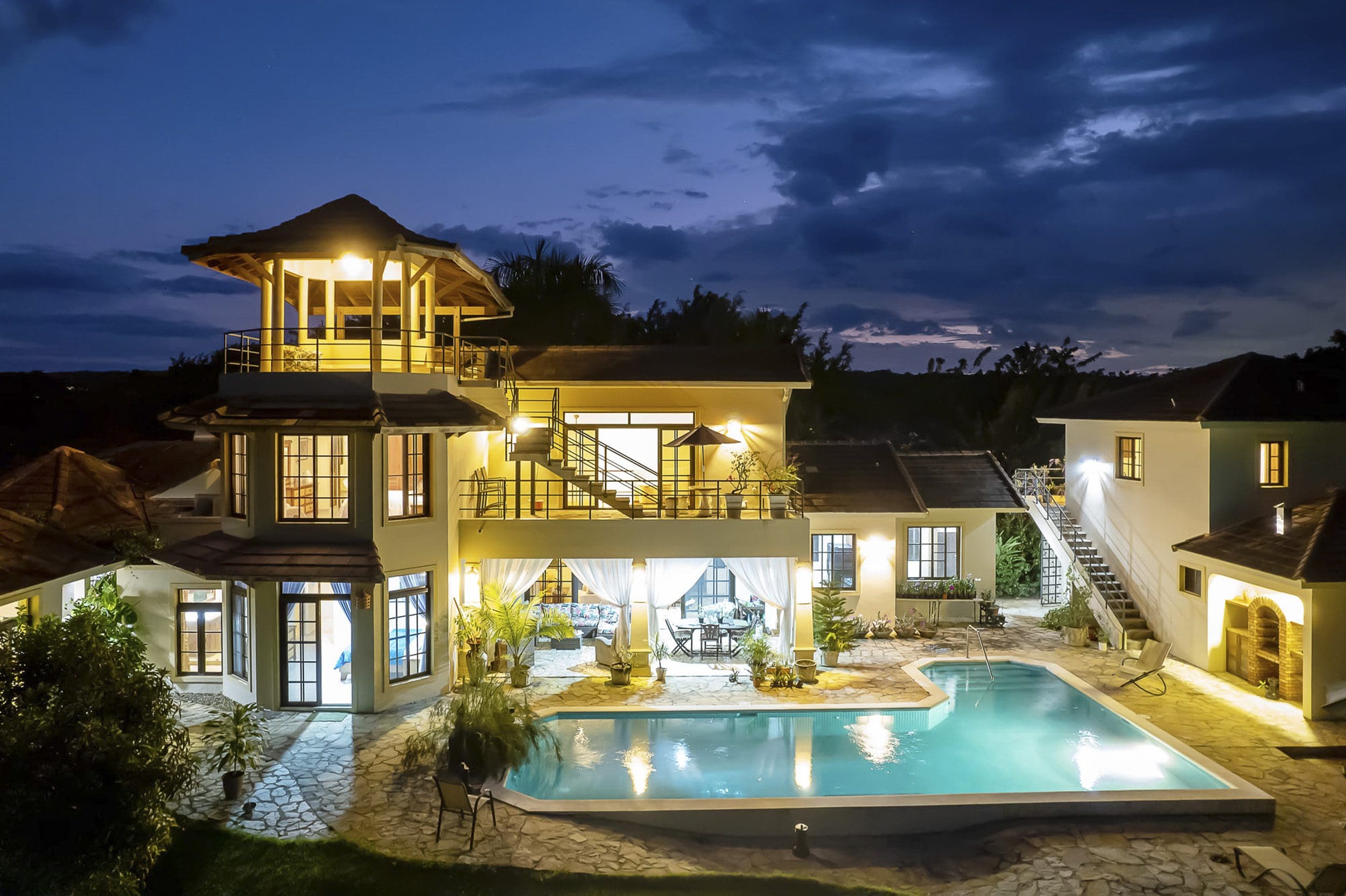 buyDRproperty Beautiful 4 Bedroom Villa in Sosua with pool at night. Part of Haciendas el Choco. Sosua Real Estate