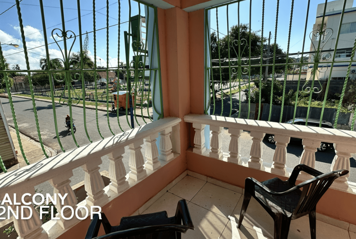 buyDRproperty Balcony view from an affordable hotel facility with street view and chairs. 2nd Floor. Sosua Real Estate