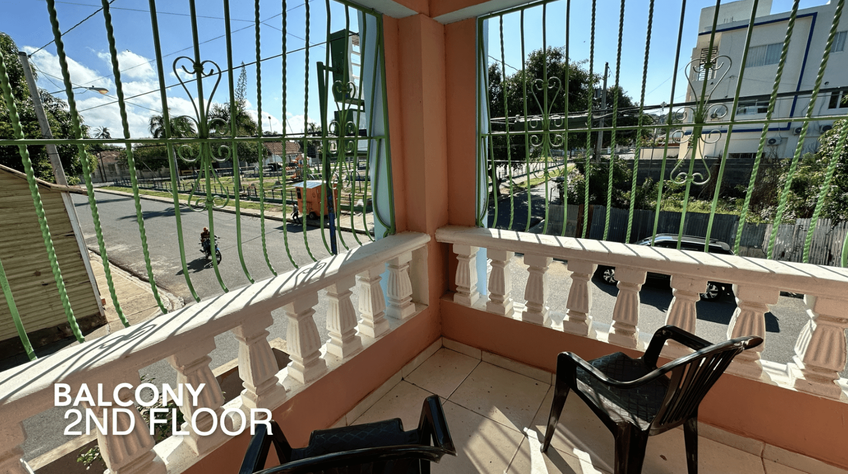 buyDRproperty Balcony view from an affordable hotel facility with street view and chairs. 2nd Floor. Sosua Real Estate
