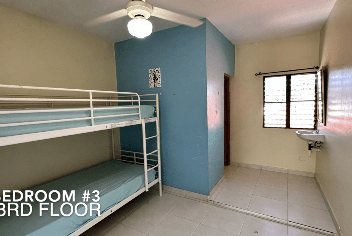 buyDRproperty Bedroom #3 on the 3rd floor of the affordable hotel facility, featuring bunk beds. Sosua Real Estate