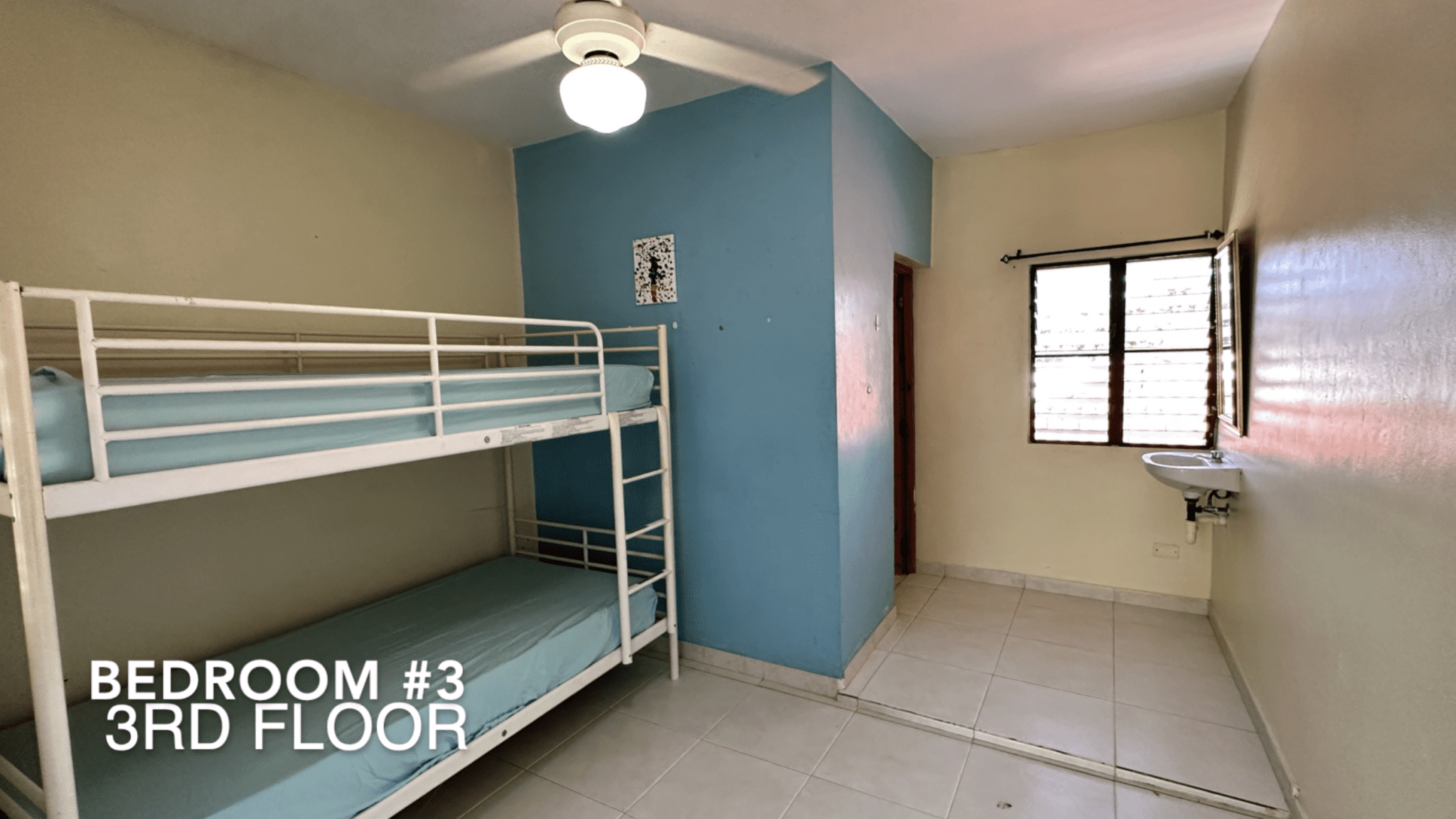 buyDRproperty Bedroom #3 on the 3rd floor of the affordable hotel facility, featuring bunk beds. Sosua Real Estate