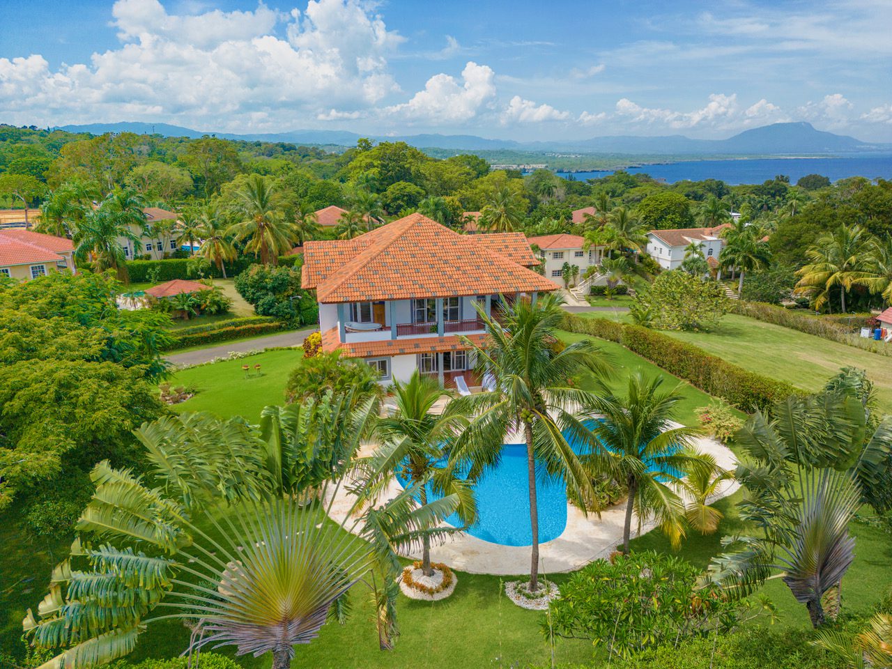 buyDRproperty Aerial view of a Wonderful 3 Bedroom Villa with a pool surrounded by palm trees. Sosua Real Estate