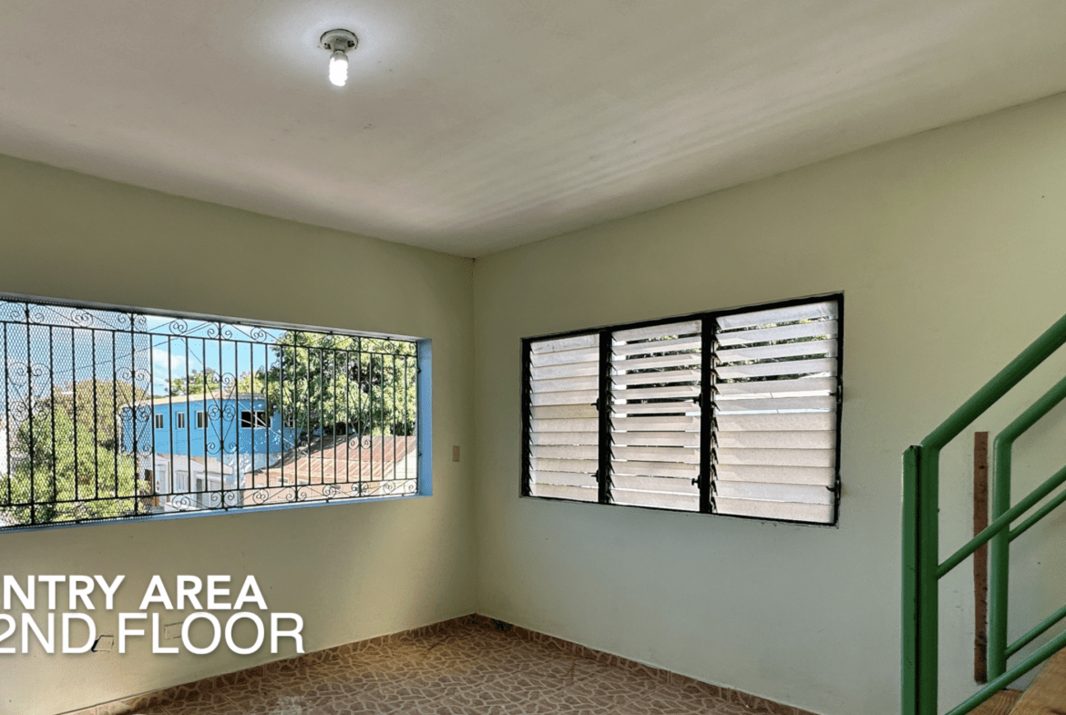 buyDRproperty Entry area on the 2nd floor with windows, staircase, and text "ENTRY AREA 2ND FLOOR. Sosua Real Estate