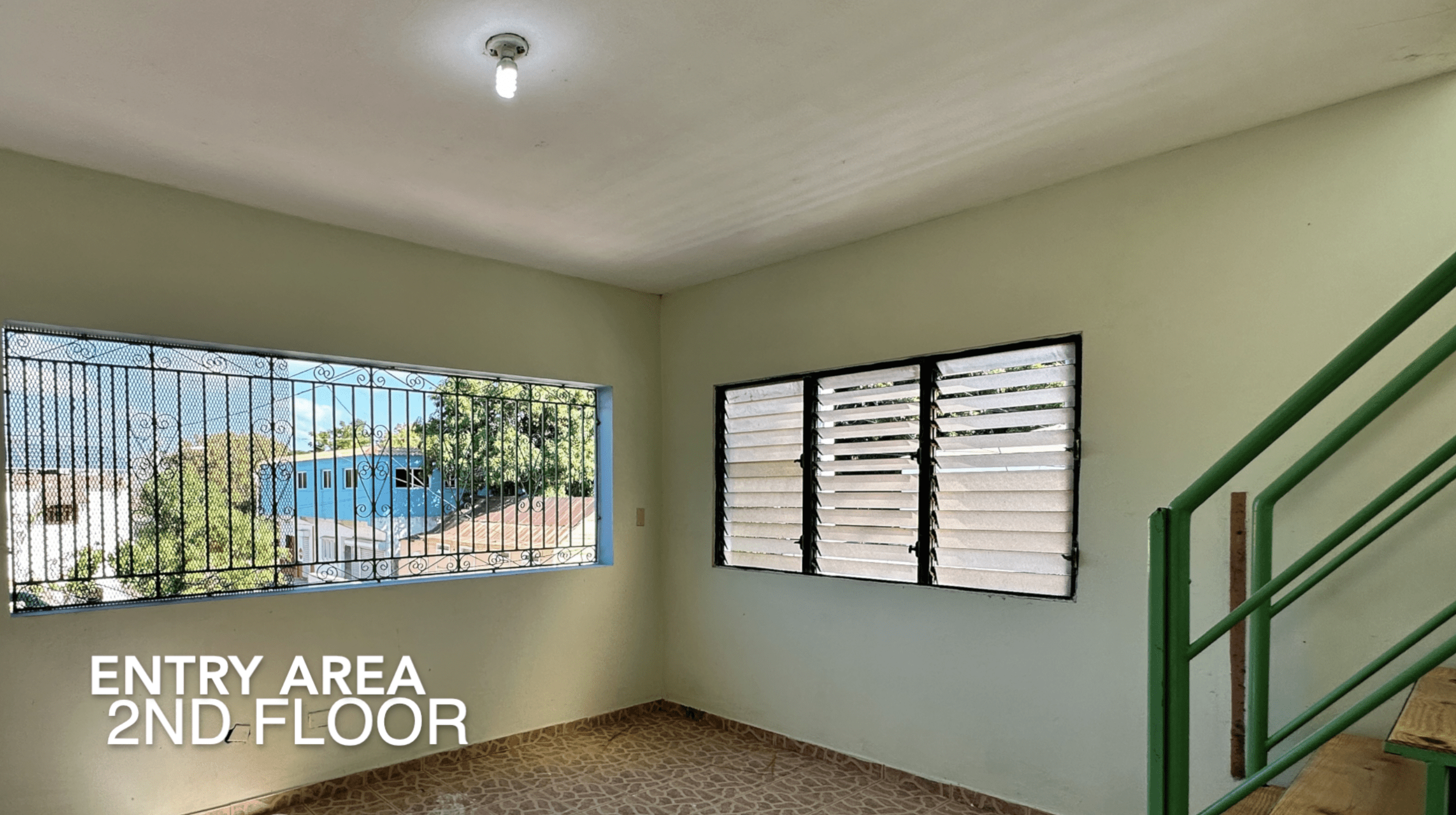 buyDRproperty Entry area on the 2nd floor with windows, staircase, and text "ENTRY AREA 2ND FLOOR. Sosua Real Estate