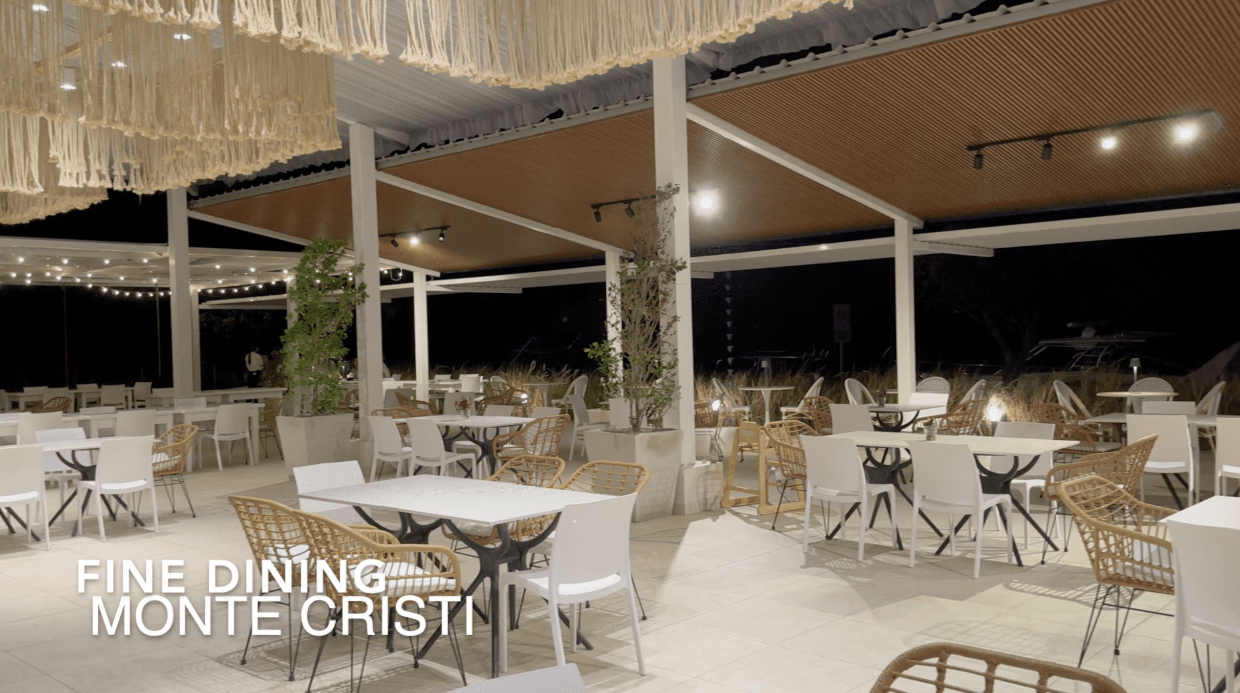 buyDRproperty Fine dining Monte Cristi restaurant with white tables and chairs. Affordable Hotel Facility. Sosua Real Estate
