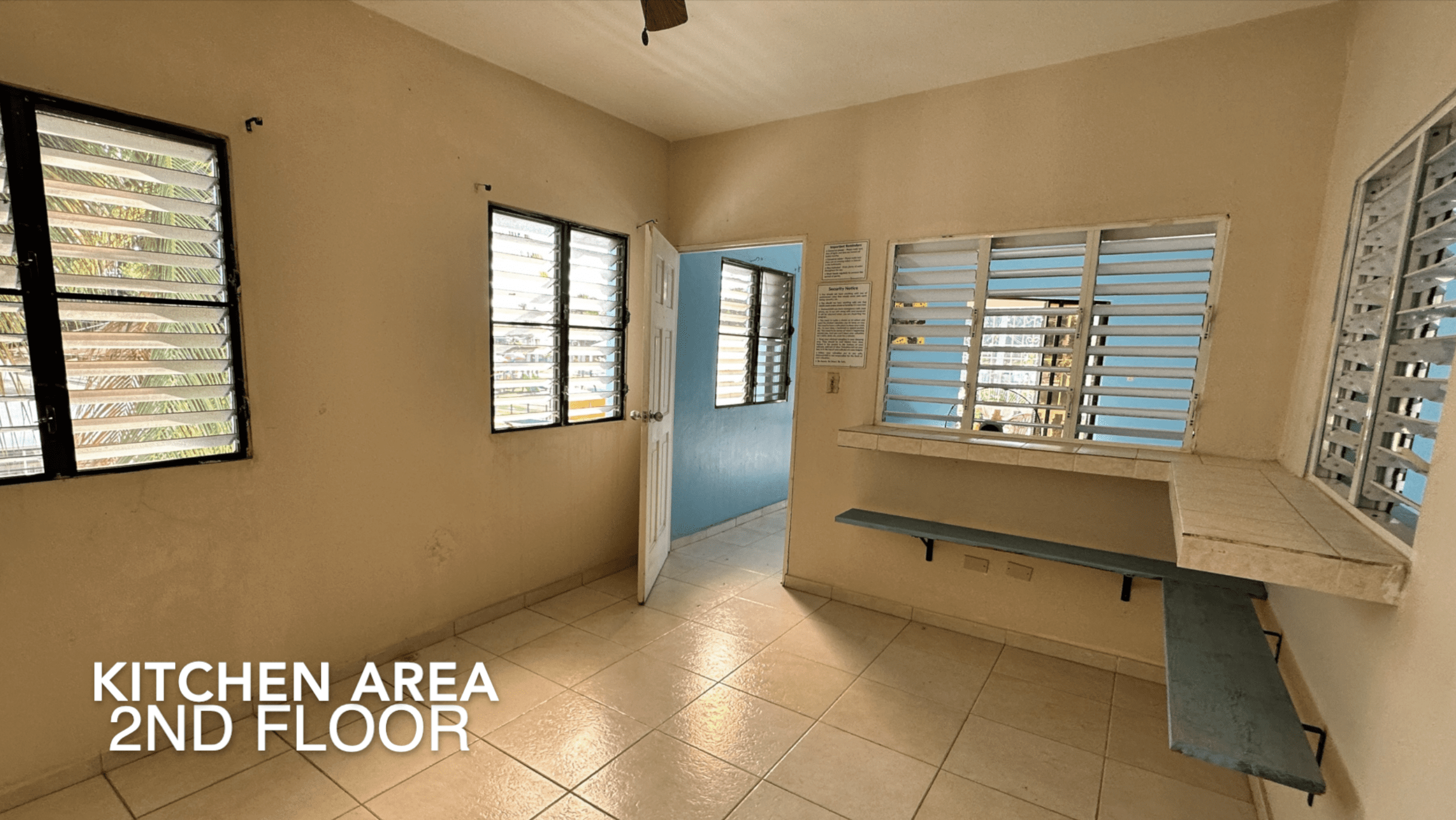 buyDRproperty Kitchen area in an Affordable Hotel Facility with tiled floors and windows. Sosua Real Estate