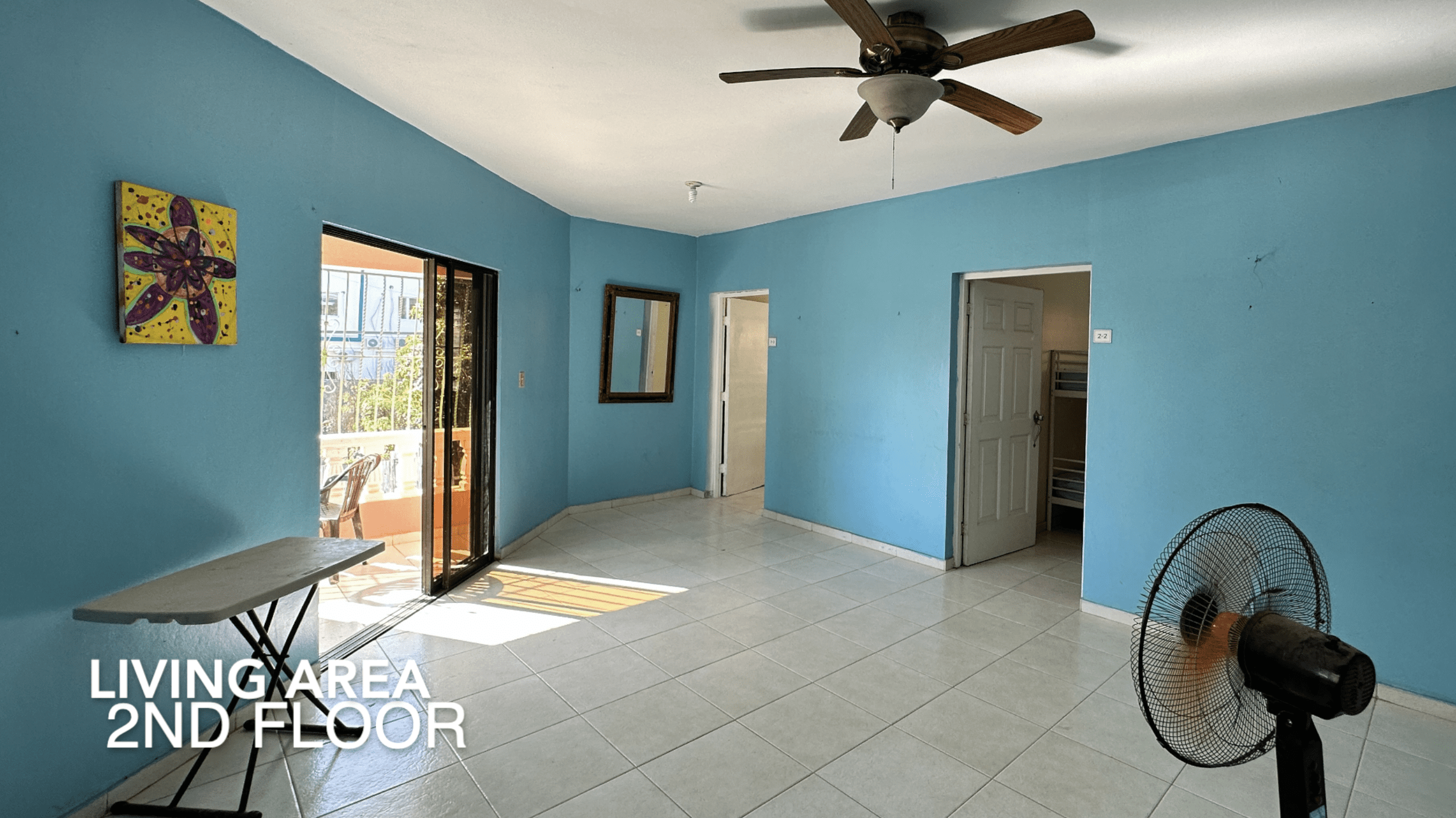 buyDRproperty Living area of an affordable hotel facility, 2nd floor with a fan Sosua Real Estate