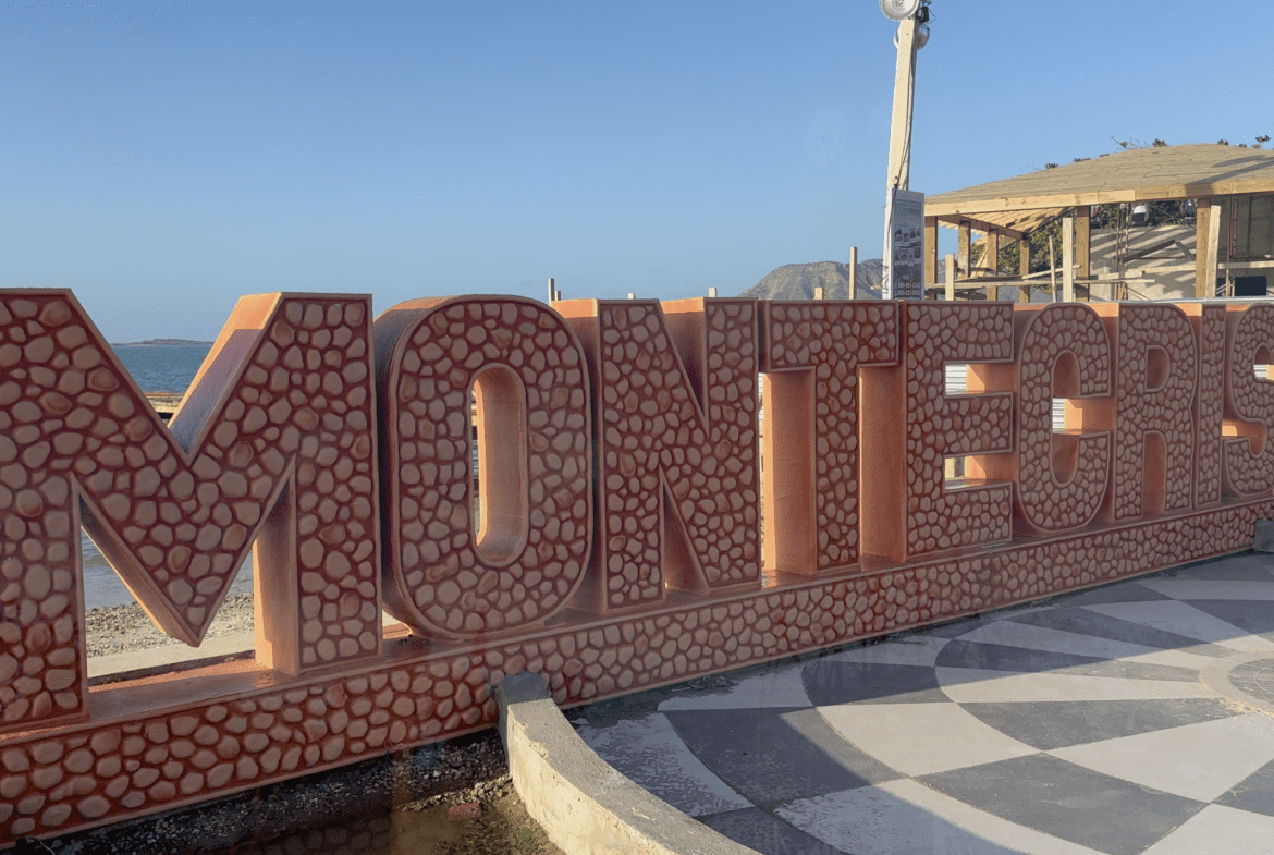 buyDRproperty Colorful Monti Cristi sign by the ocean, highlighting local attractions Sosua Real Estate