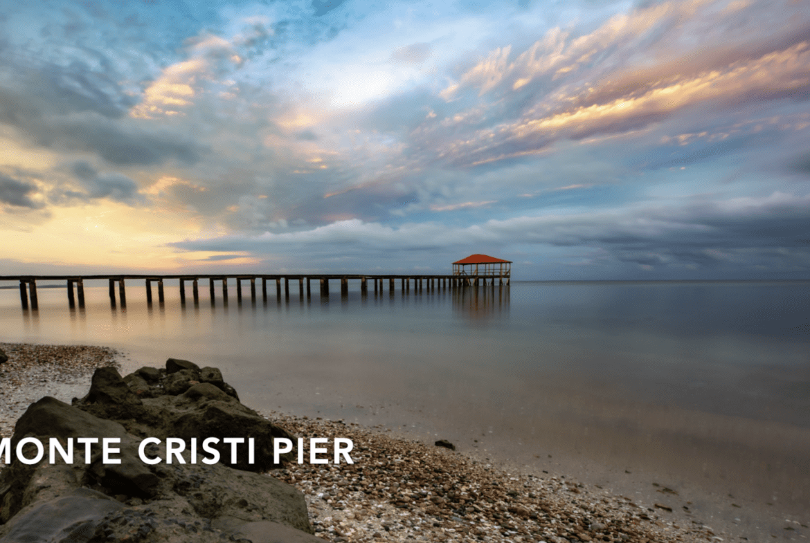 buyDRproperty Monte Cristi Pier at sunset with cloudy sky. Hostel Business for sale. Sosua Real Estate