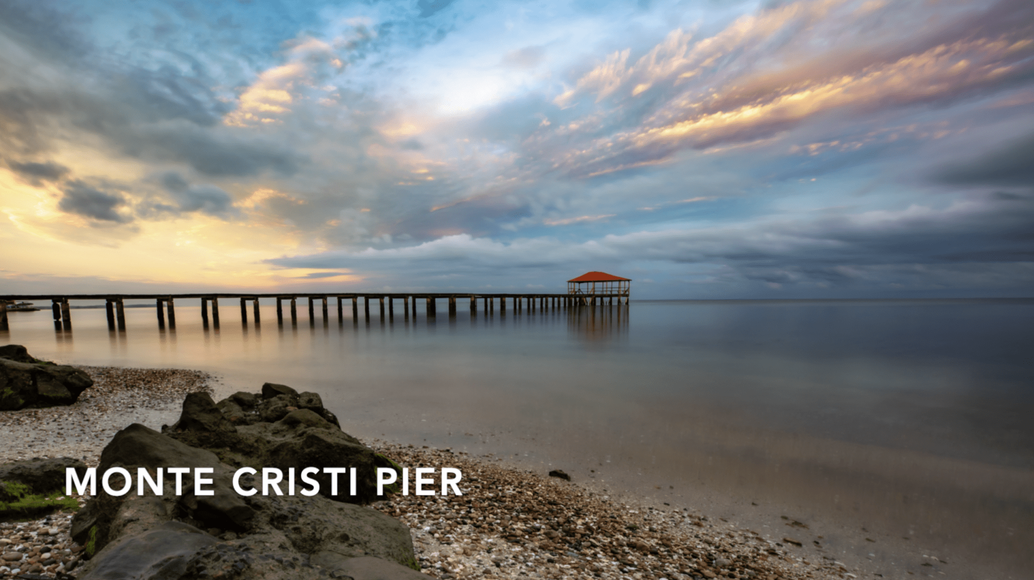 buyDRproperty Monte Cristi Pier at sunset with cloudy sky. Hostel Business for sale. Sosua Real Estate