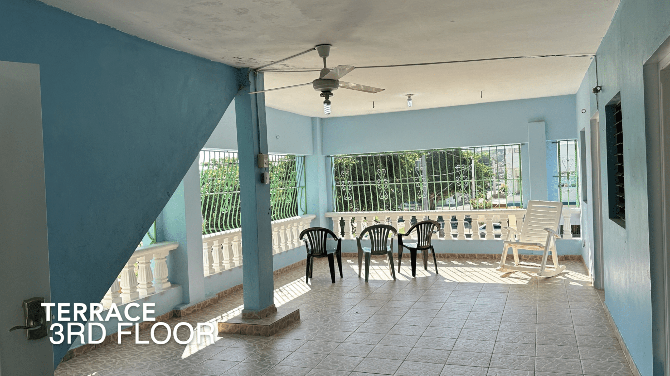 buyDRproperty Terrace on the 3rd floor of an affordable hotel facility with chairs and a ceiling fan. Sosua Real Estate