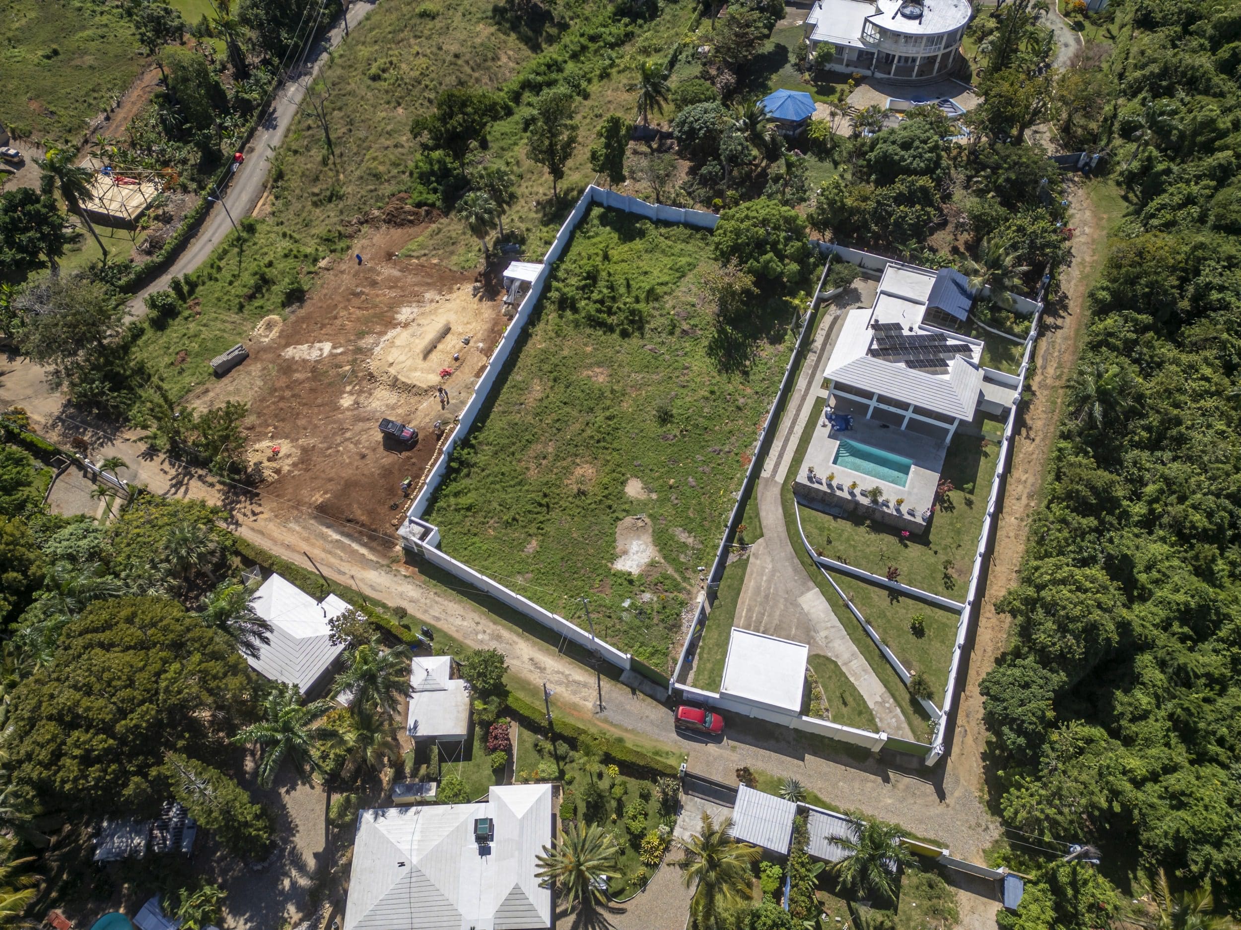 buyDRproperty Aerial view of lots for sale in La Mulata, one with a house and pool Sosua Real Estate