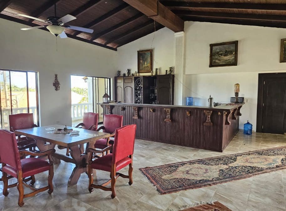 buyDRproperty Spacious interior of a hotel near the beach with a bar and dining area. Sosua Real Estate