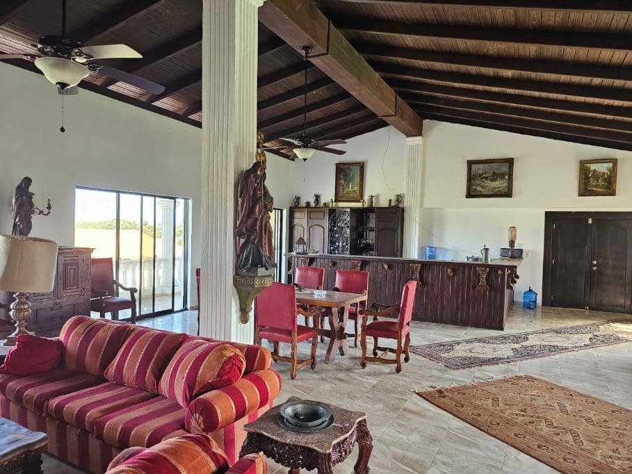 buyDRproperty Spacious living room with bar and dining area in a hotel near the beach. Sosua Real Estate