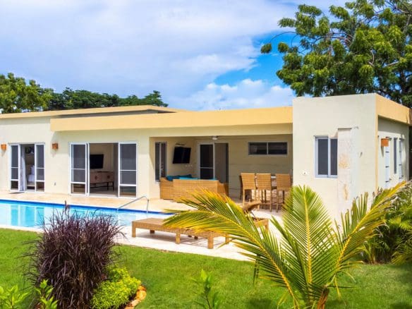 buyDRproperty Beautiful Villa CAPRI with a pool and outdoor seating area. Sosua Real Estate