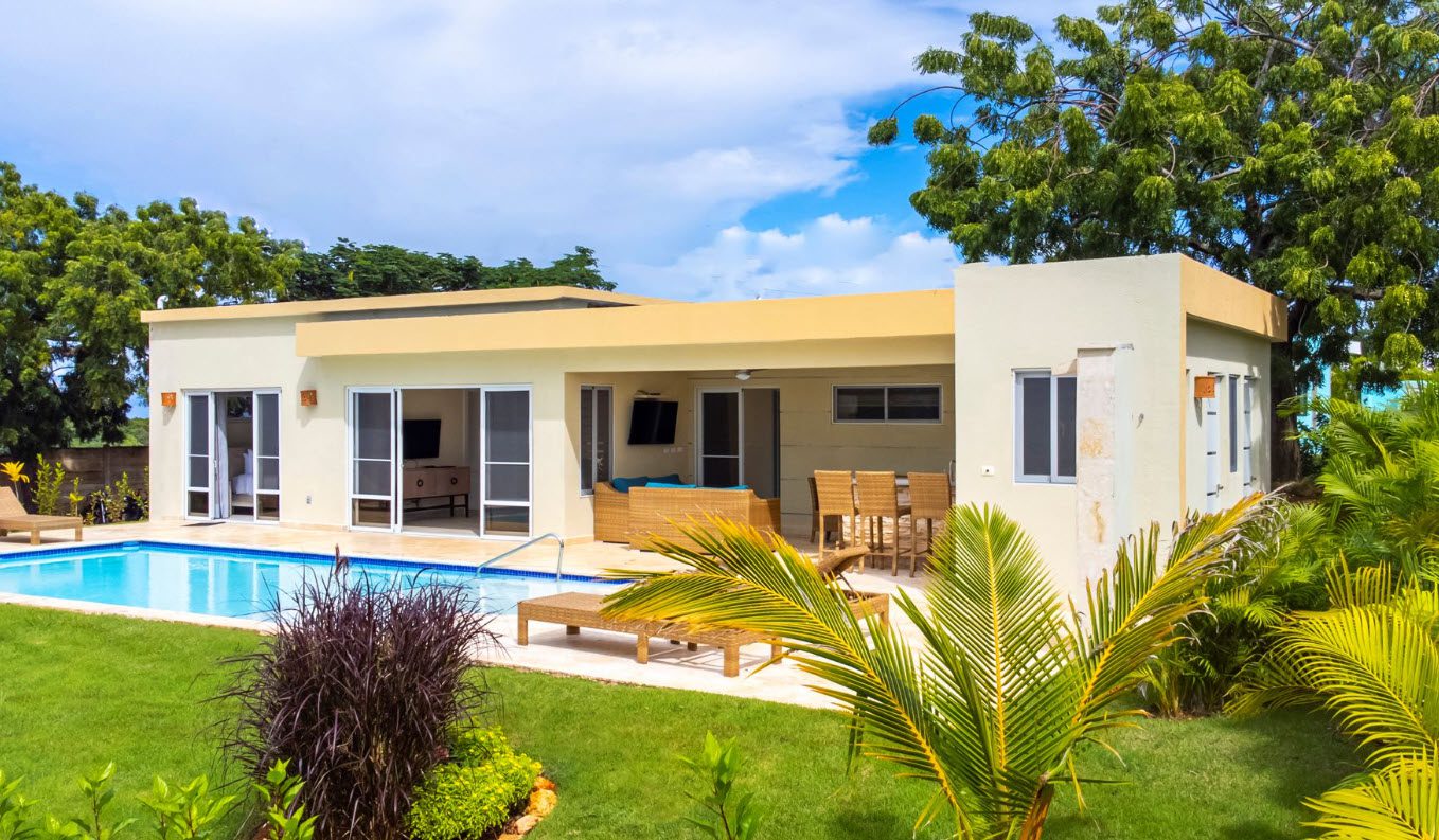buyDRproperty Beautiful Villa CAPRI with a pool and outdoor seating area. Sosua Real Estate