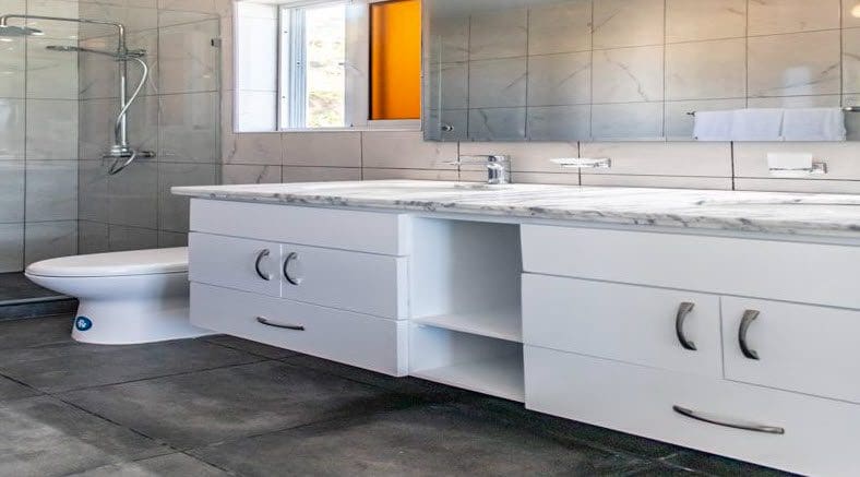 buyDRproperty Beautiful Villa SUNBREEZE bathroom with white vanity and marble countertop. Sosua Real Estate