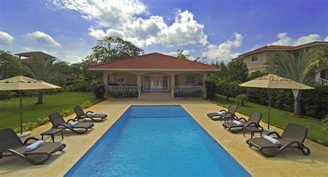 buyDRproperty Beautiful 3 Bedroom Villa LOTUS in Residential Hispaniola with pool and lounge chairs Sosua Real Estate