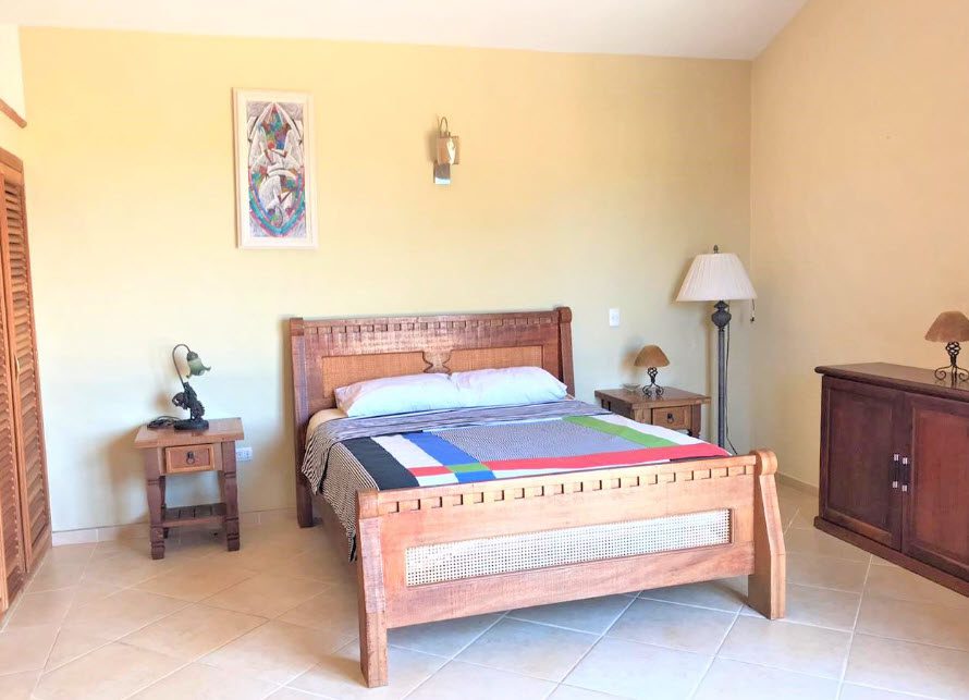 buyDRproperty Bedroom in a beautiful 5 bedroom villa with wooden furniture Sosua Real Estate