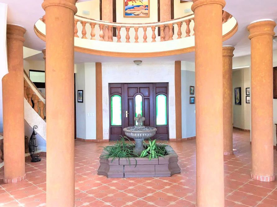 buyDRproperty Elegant foyer of a beautiful 5 bedroom villa with a fountain and columns Sosua Real Estate
